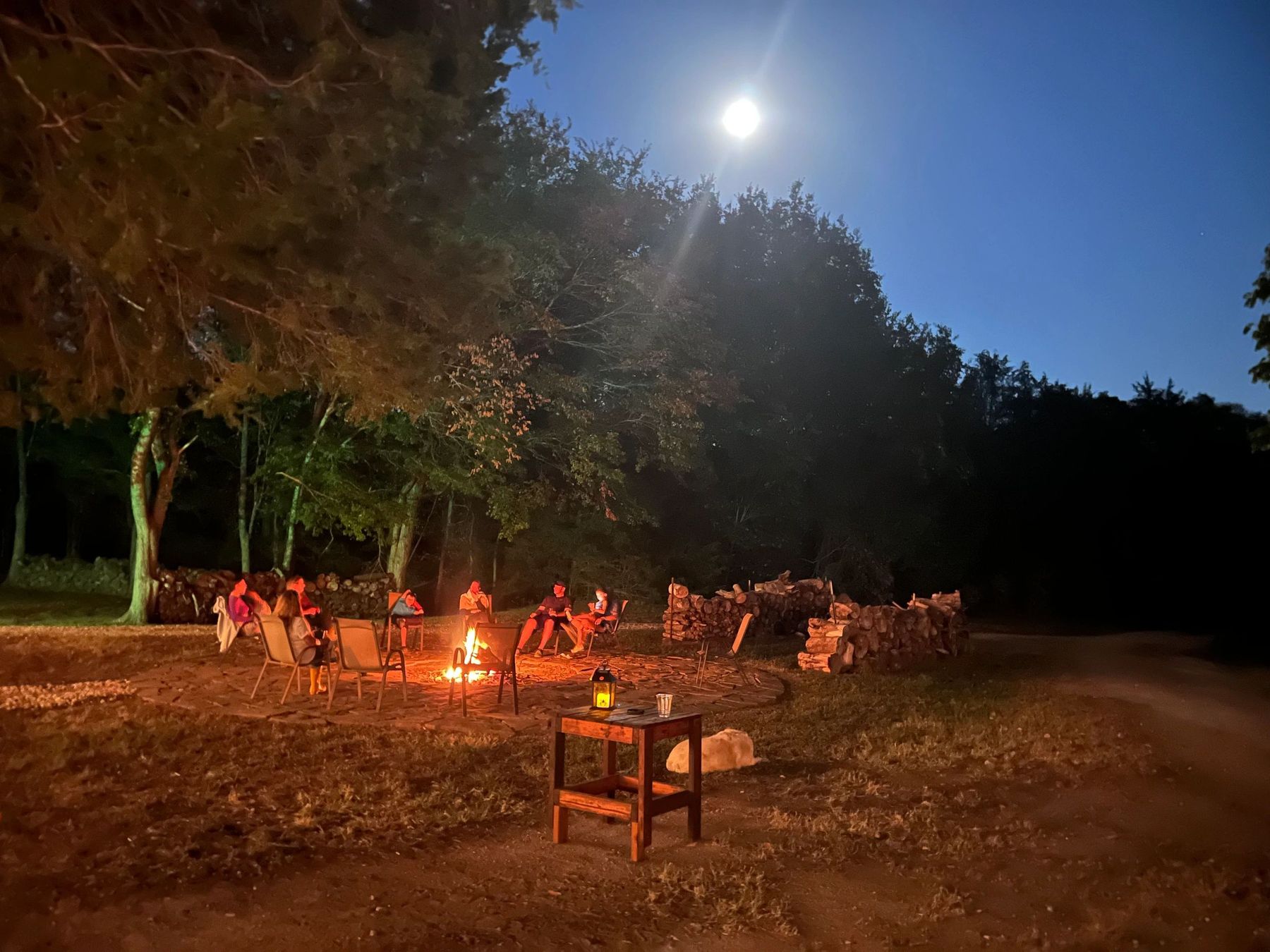 Guests around the campfire at night